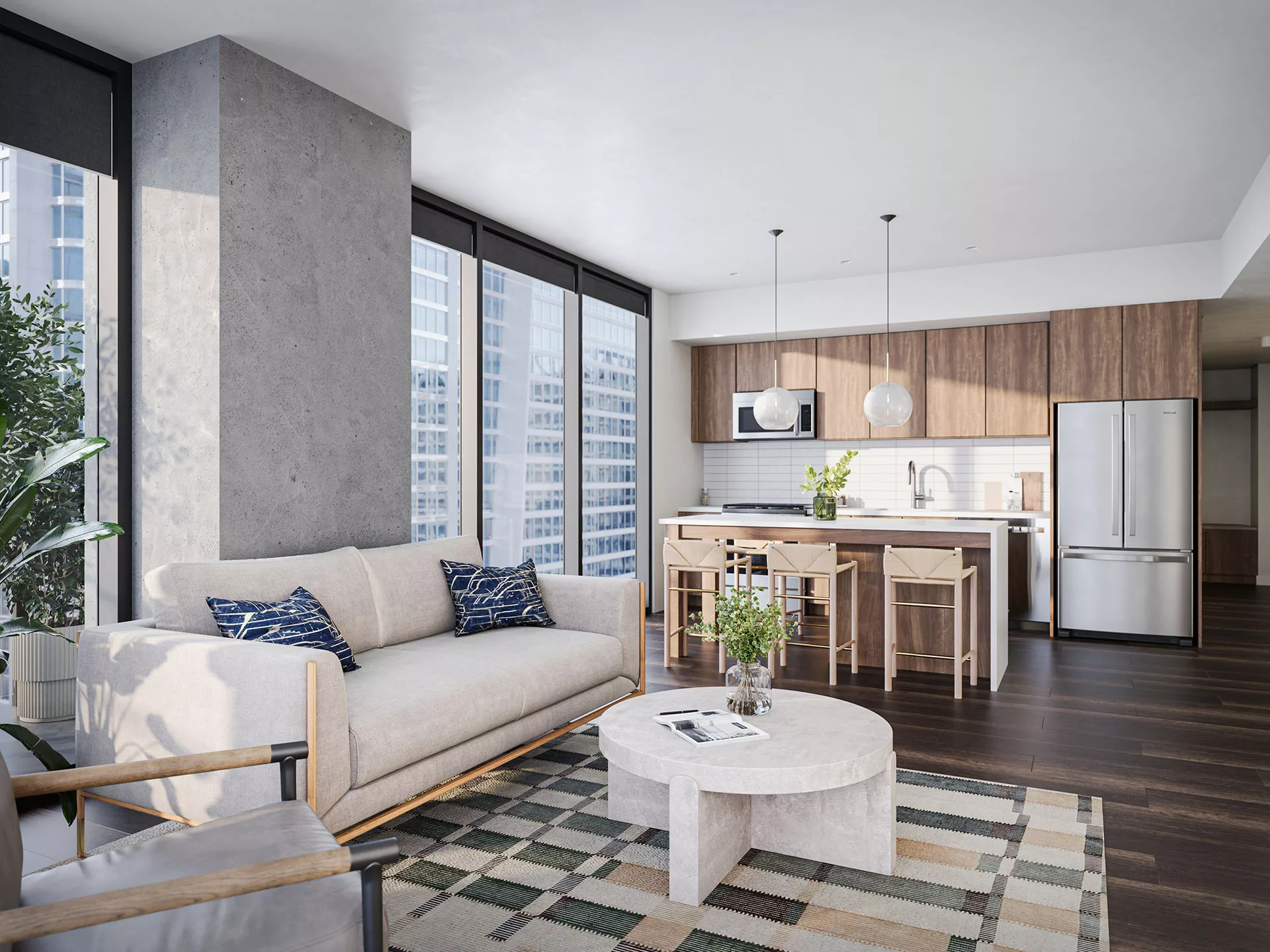 The Lindley kitchen with wood cabinets, stainless appliances, center island and open living area