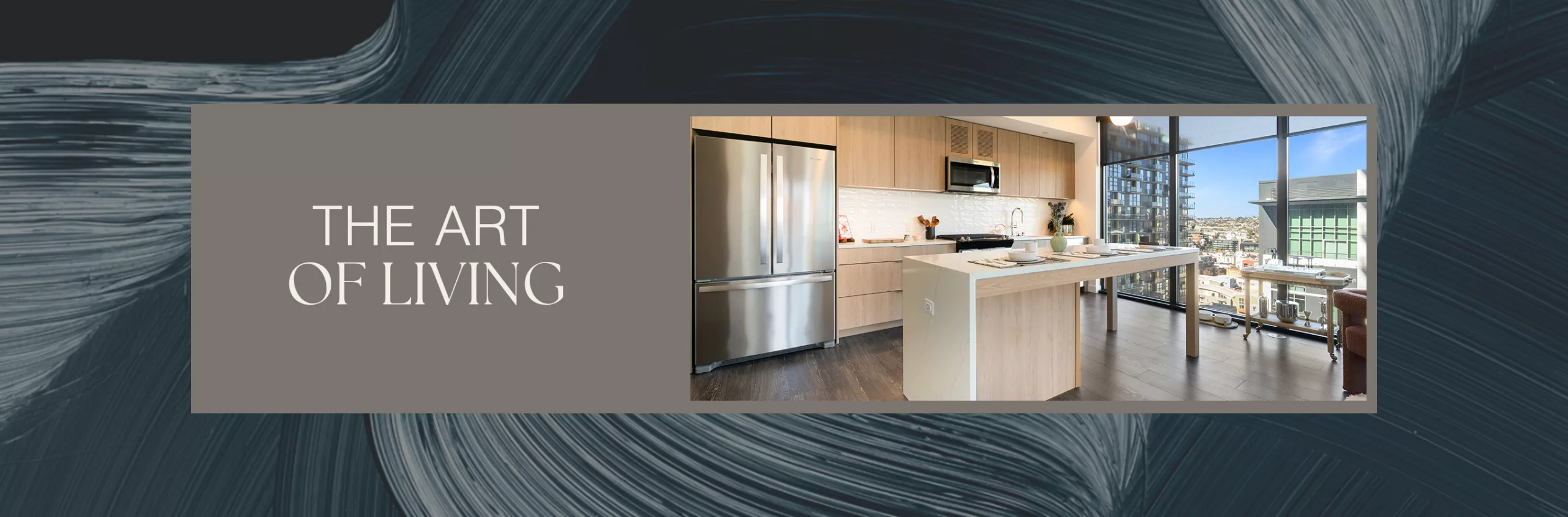 Modern kitchen with light wood cabinetry, island seating, and large city-view windows.